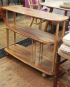 Ercol light elm three-tier shelving unit/bookcase on castors,