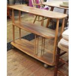 Ercol light elm three-tier shelving unit/bookcase on castors,