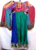 Three mid 20th century Pashtun dresses from Afghanistan - A young woman's red dress with old