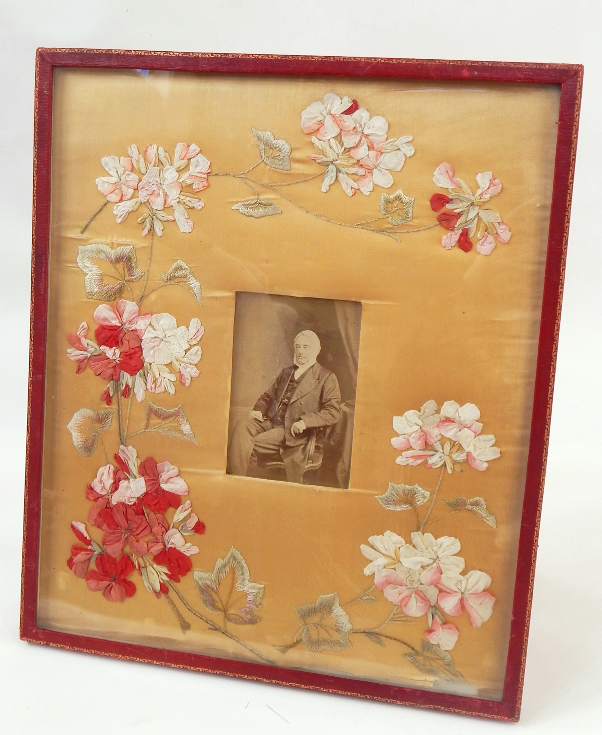 Large red leather gilt tooled photographe frame, with an embroidered and silk applique flowers,