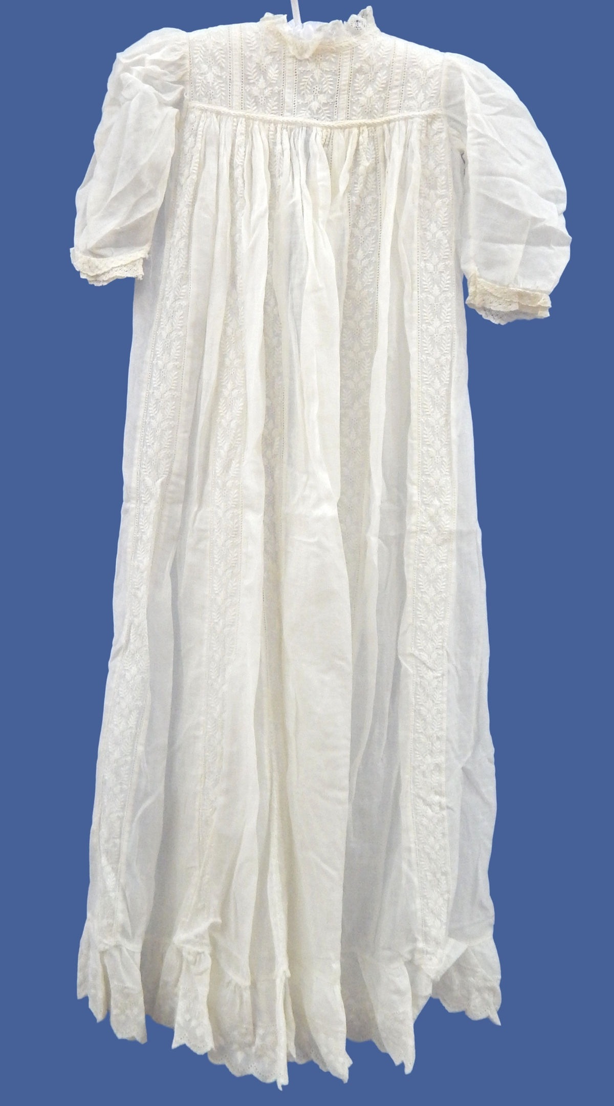 An early 20th century christening gown with lace detail,