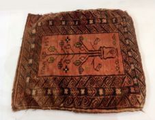 Middle Eastern saddle bag rug, red ground with central tree design and Aztec striped borders,