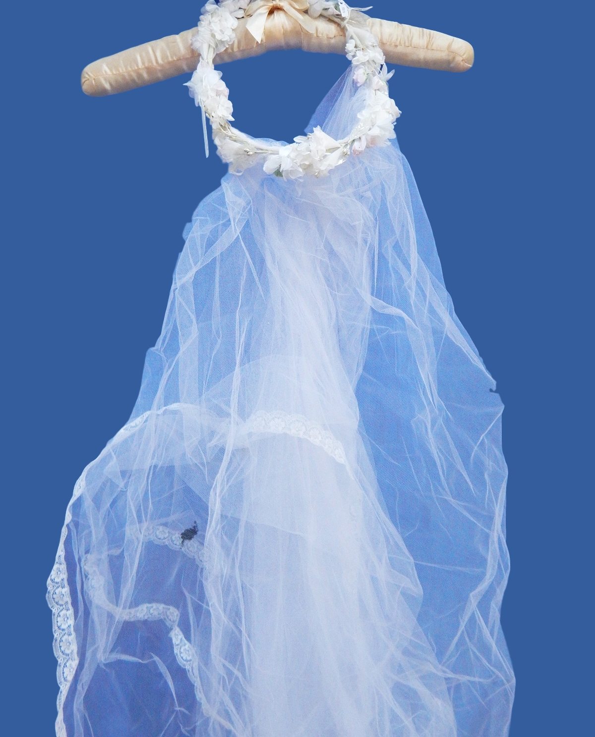 Three modern white net wedding veils, one with a head-dress and four vintage veils,