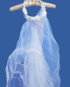 Three modern white net wedding veils, one with a head-dress and four vintage veils,