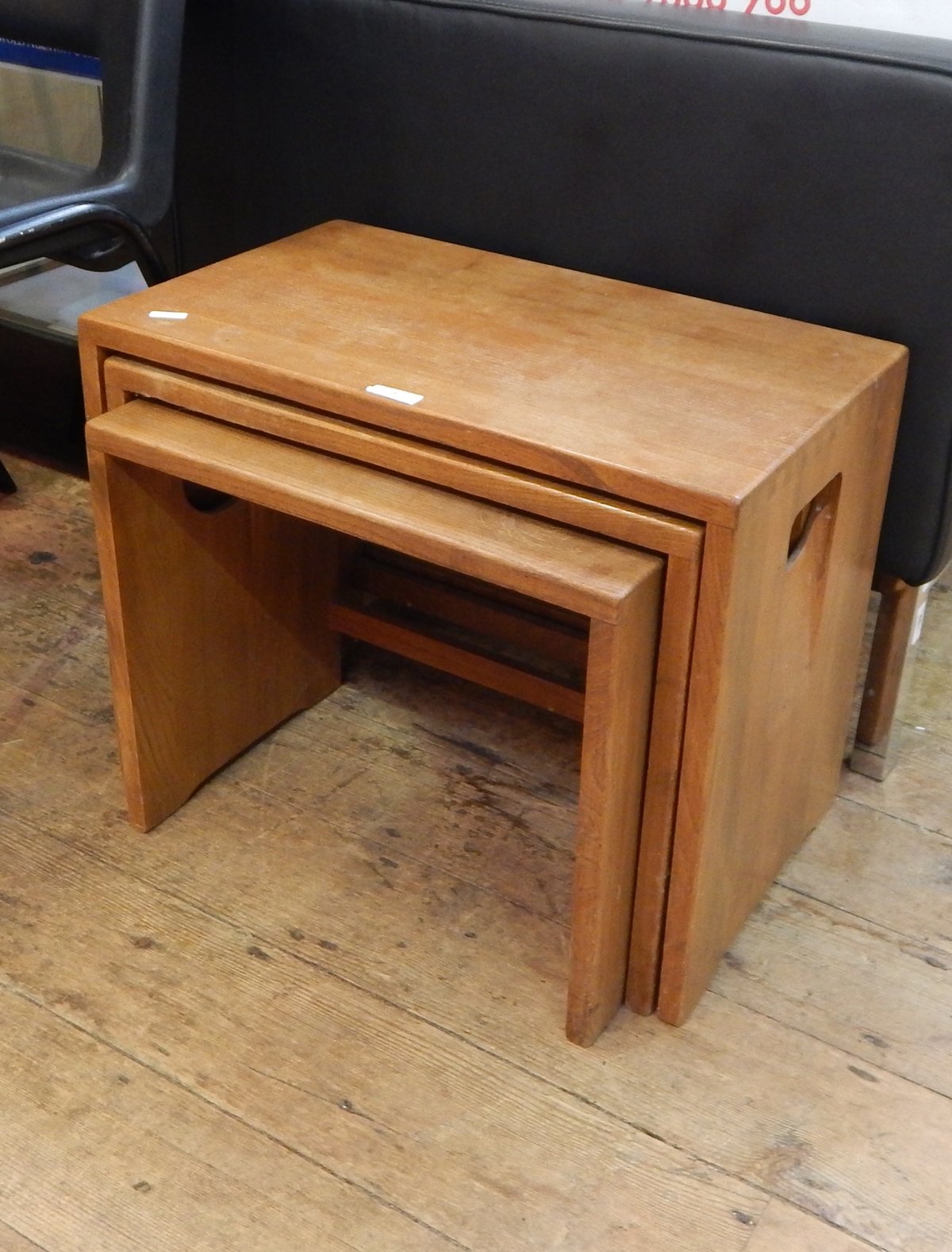 Early 20th century rectangular, Ercol style, nest of three tables with integral handles to sides,