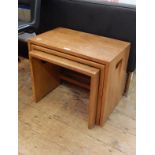 Early 20th century rectangular, Ercol style, nest of three tables with integral handles to sides,