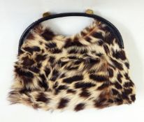 1950's ocelot bag with circular leather handles with brass coloured clasps