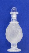 A Lalique scent bottle, decorated with dancing maidens, marked to base,