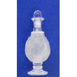 A Lalique scent bottle, decorated with dancing maidens, marked to base,