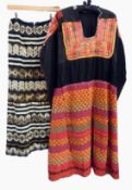 A black ethnic style dress the skirt with multicoloured triangular pattern,