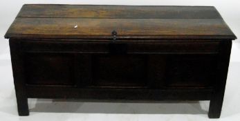 Early 18th century oak coffer with a three-panelled carved front and similarly carved two-panelled