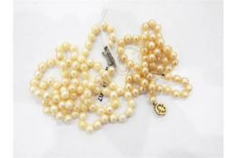 Single strand of uniform cultured pearls with a 9ct gold ropetwist clasp and a second single row of