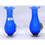 Pair of Murano blue cased vases with floral relief decoration,