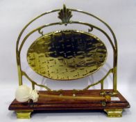 20th century brass table gong with oak rectangular base, on bracket shaped feet,