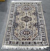 Beige ground, rectangular rug with triple totem,