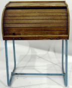 20th century pine child's desk with rolled top front enclosing pigeonholes, on metal base,
