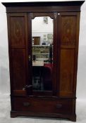 Edwardian mahogany and satinwood inlaid wardrobe, the central mirrored door with bevelled plate,