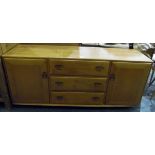 Ercol 1970's elm sideboard with three short drawers, flanked by pair cupboards,