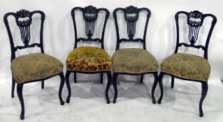 Set of four Edwardian mahogany dining/salon chairs with shaped and carved crest rail and pierced