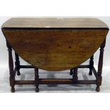 Old oak oval-top gateleg table with moulded edge, on turned baluster supports,