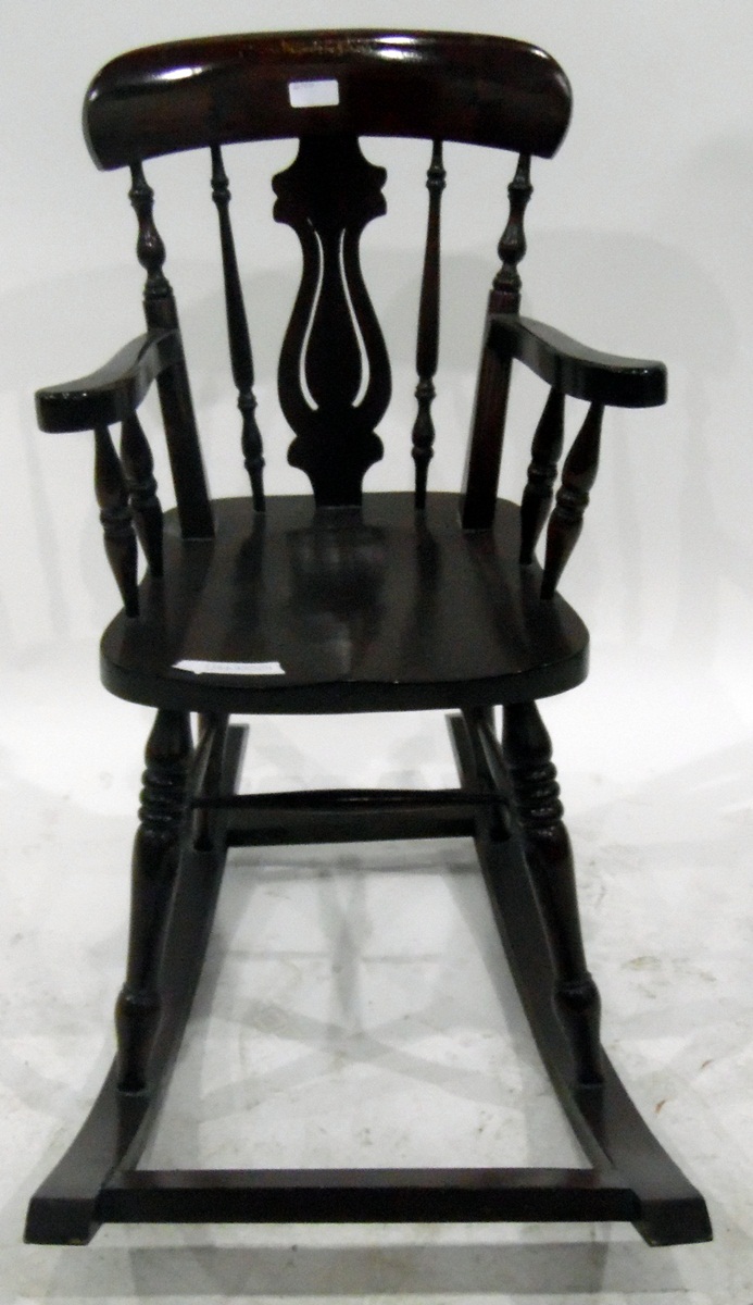 Child's stained as mahogany rocking chair with pierced vase and turned spindle back