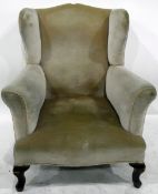 Wingside easy chair raised on squat cabriole supports