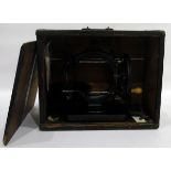 Late 19th century C-framed sewing machine, undecorated, with turned wood handle,