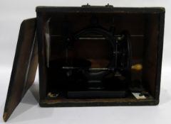 Late 19th century C-framed sewing machine, undecorated, with turned wood handle,