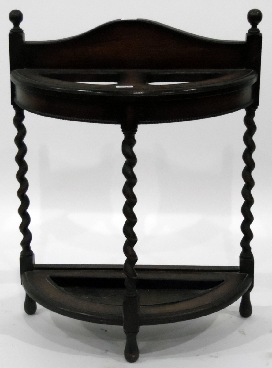 Early 20th century and demi-lune oak stick umbrella stand on spiral turned supports and with metal