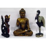 Modern model of Buddha on carved hardwood stand and two painted models of heron and dragon (4)
