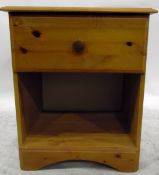 Pine bedside cupboard with frieze drawer and open shelf below,