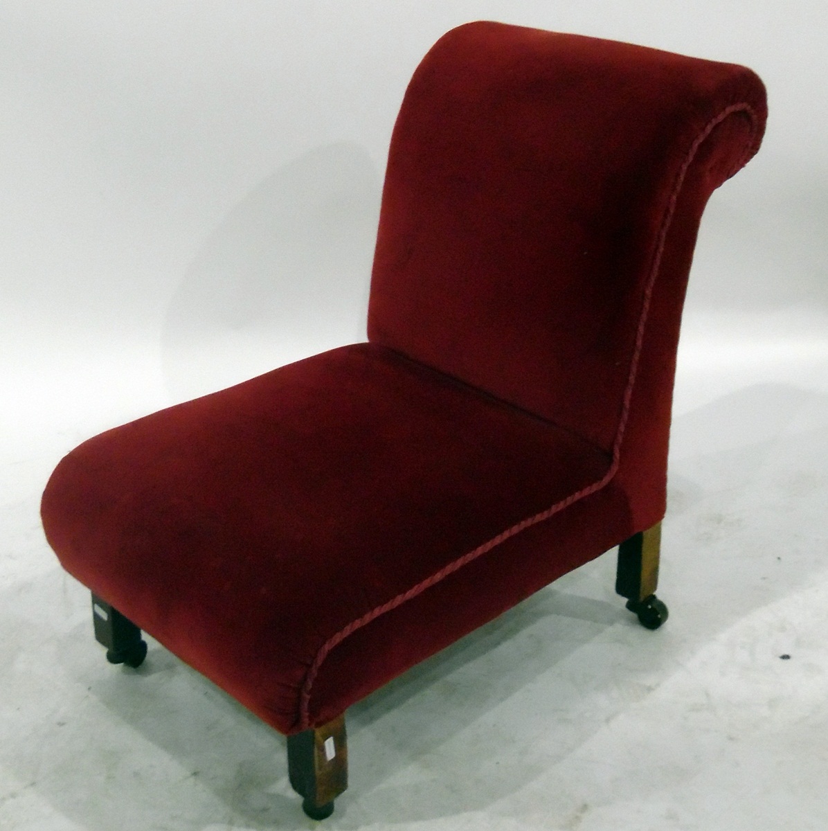 19th century red velvet upholstered bedroom chair on straight supports and castors