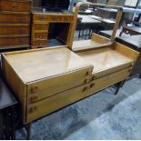 Circa 1950's teak-finish dressing table fitted a mirror and having five drawers, by Meredew,