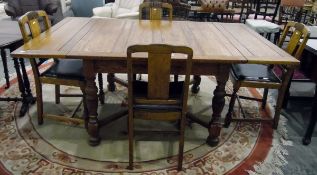 20th century oak extending dining table, on turned supports united by cross stretchers,