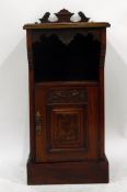 Mahogany bedside table with pigeonhole above carved panel cupboard, on plinth base, 39.
