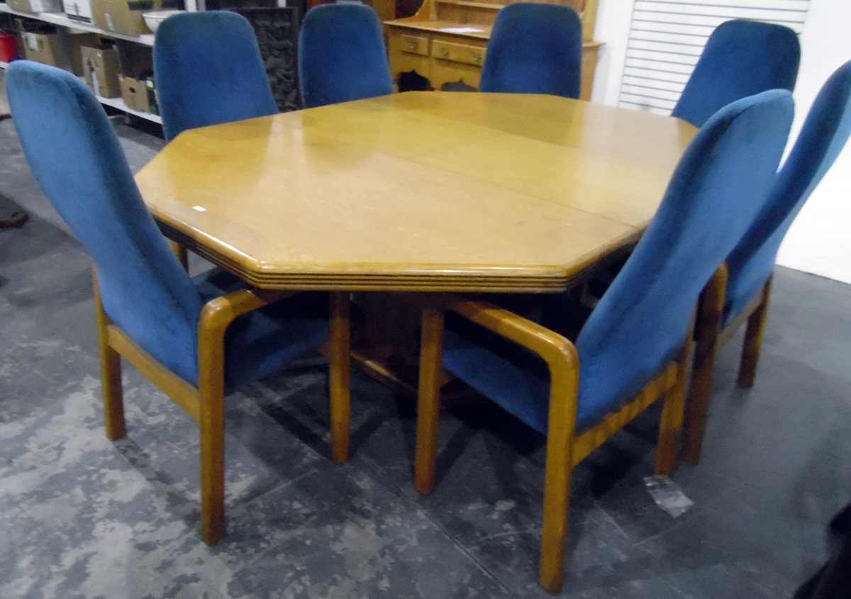 Oak octagonal extending boardroom/dining table on block style pedestal,