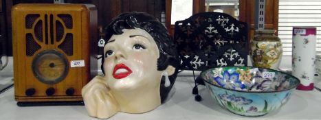 Early 20th century radio, a large ceramic head of a woman, marked 'Stoke on Trent' to base,