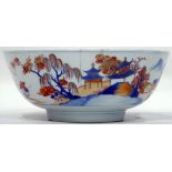 Chinese Imari porcelain bowl painted with figures in rocky landscape with buildings,