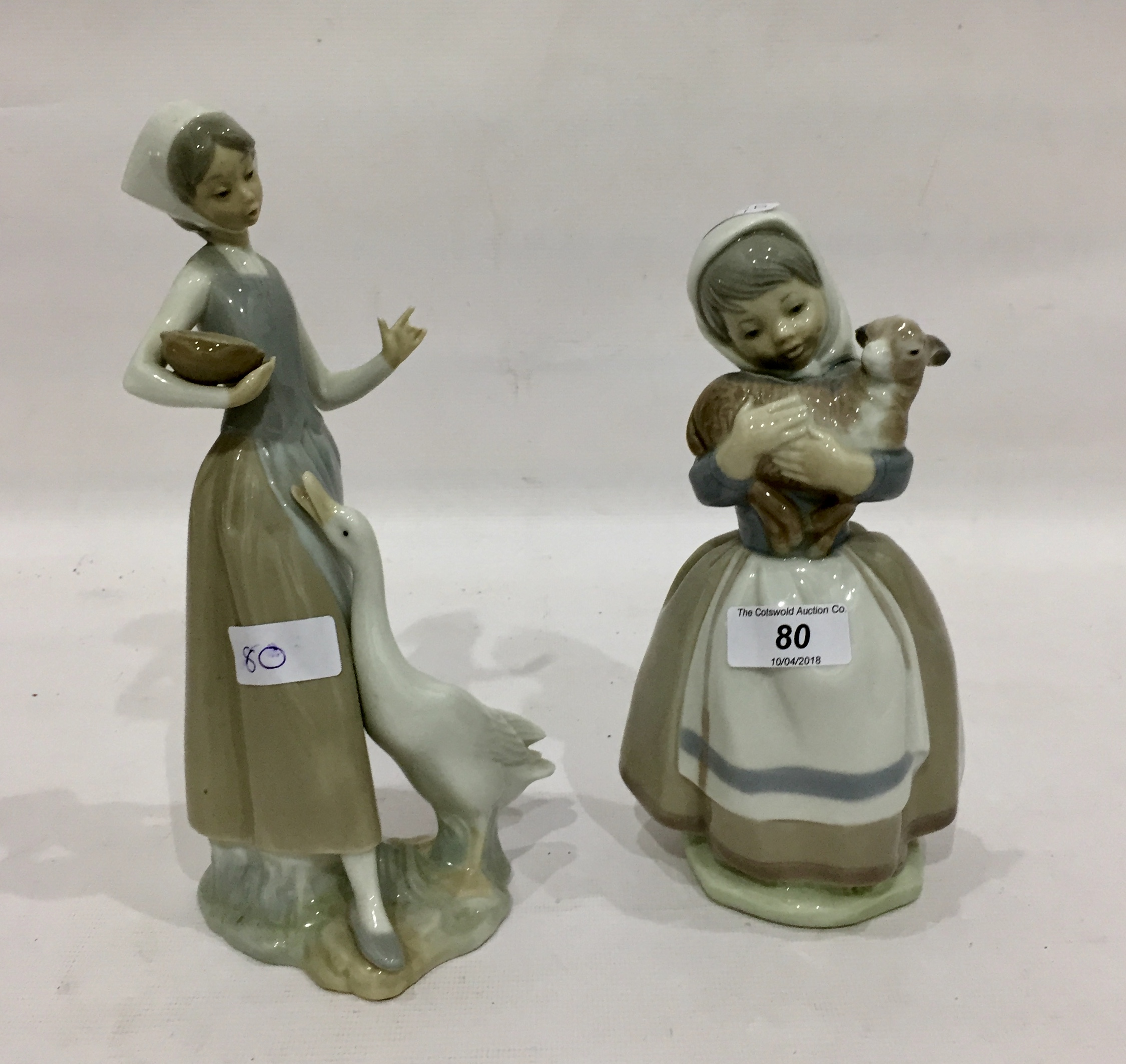 Lladro figure of a girl feeding a goose and a Spanish figure of a girl holding a lamb (2) - Image 2 of 2