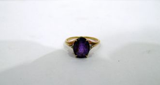 9ct gold, amethyst and diamond ring, the central oval amethyst 9mm x 8mm approx,