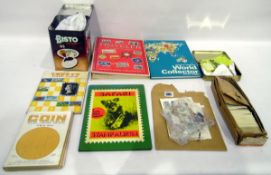 Quantity of ephemera to include collection of trade cards, loose stamps,