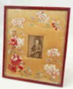 Large red leather gilt tooled photograph frame, with an embroidered and silk applique flowers,
