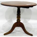 Circular pine pedestal table on tripod supports,
