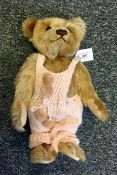 Steiff bear in pink dungarees,