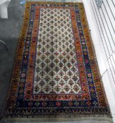 Persian-style wool runner, cream ground with orange, blue and red border,