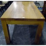 Modern oak dining table, the rectangular top above a plain frieze, on square legs,
