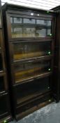 Four-tier Wernicke-type sectional bookcase with drawer to bottom section,