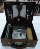 Square leather picnic hamper with silver plated flatware, enamel trays, china teacups,