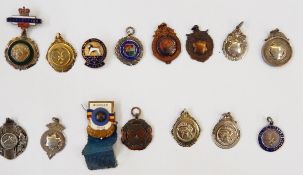 Seven various sporting pendant medals, some variously enamelled and parcel-gilt,