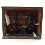 Late 19th century C-framed sewing machine, undecorated, with turned wood handle,